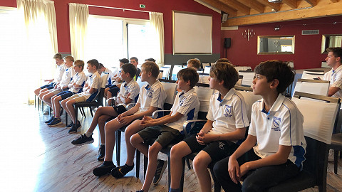 A young football squad get some training tips on their sports tour to Atalanta