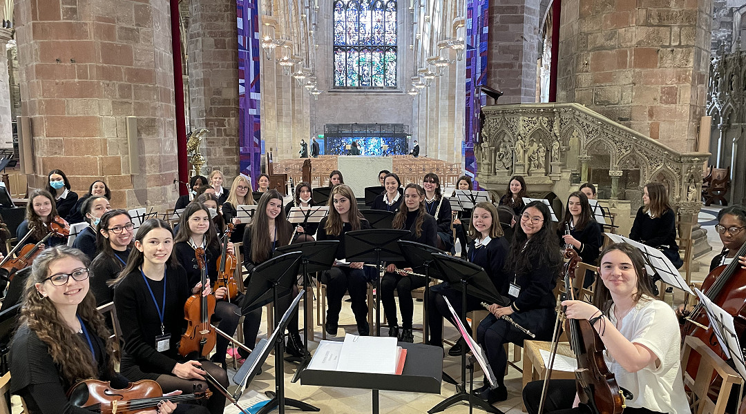 school orchestra tour group perform in St Giles Cathedral